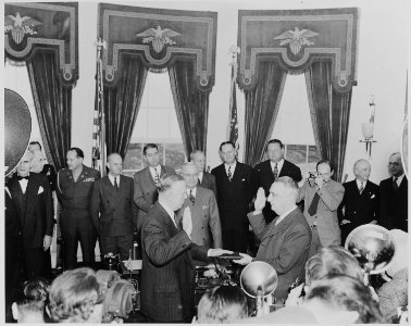Photograph of George C. Marshall being sworn in as Secretary of State by Chief Justice Fred Vinson in the Oval... - NARA - 199522 photo