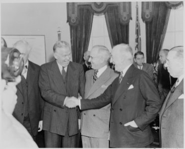 Photograph of George C. Marshall shaking hands with his predecessor as Secretary of State, James Byrnes, as President... - NARA - 199519