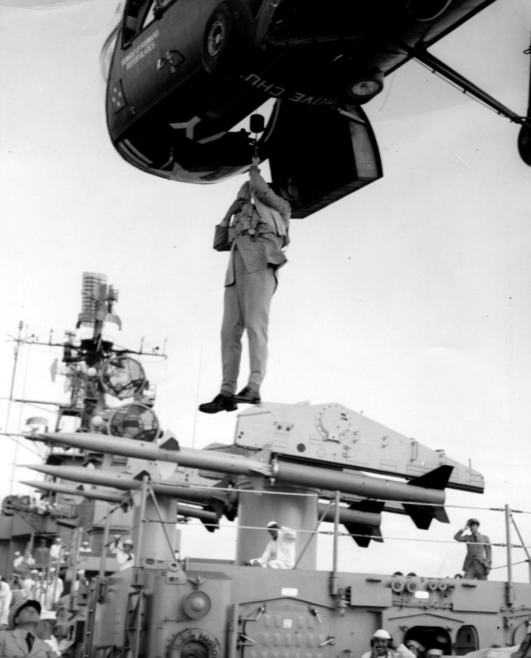 Piasecki HUP Retriever delivers man to USS Boston (CAG-1), in 1957 (L45-33.02.05)