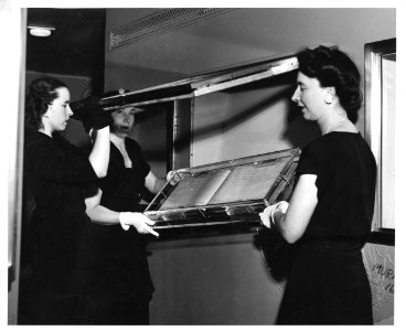 Photograph of Ms. Hamer Installing Display Documents on the Freedom Train (19087843531)