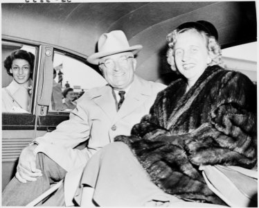 Photograph of President Truman and his daughter Margaret Truman in the back of their limousine, upon their return... - NARA - 200211