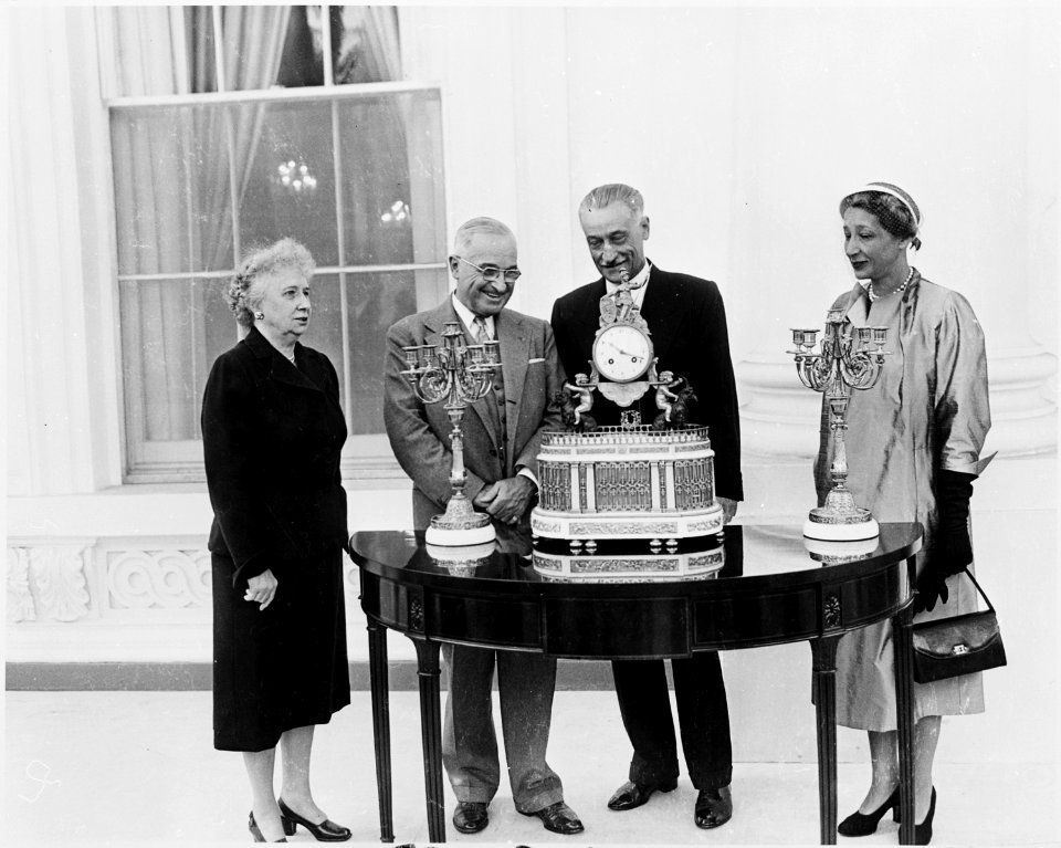 Photograph of President Truman at the White House receiving a musical clock and two candelabra, a gift for the... - NARA - 200364
