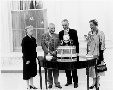 Photograph of President Truman at the White House receiving a musical clock and two candelabra, a gift for the... - NARA - 200364
