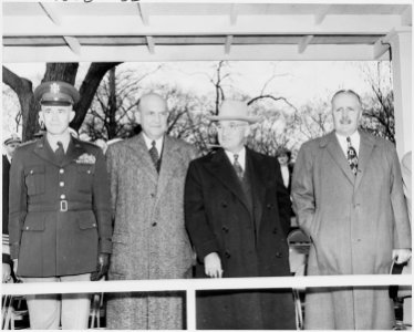 Photograph of President Truman reviewing a parade during ceremonies in honor of Army Day, flanked by General Omar... - NARA - 200105