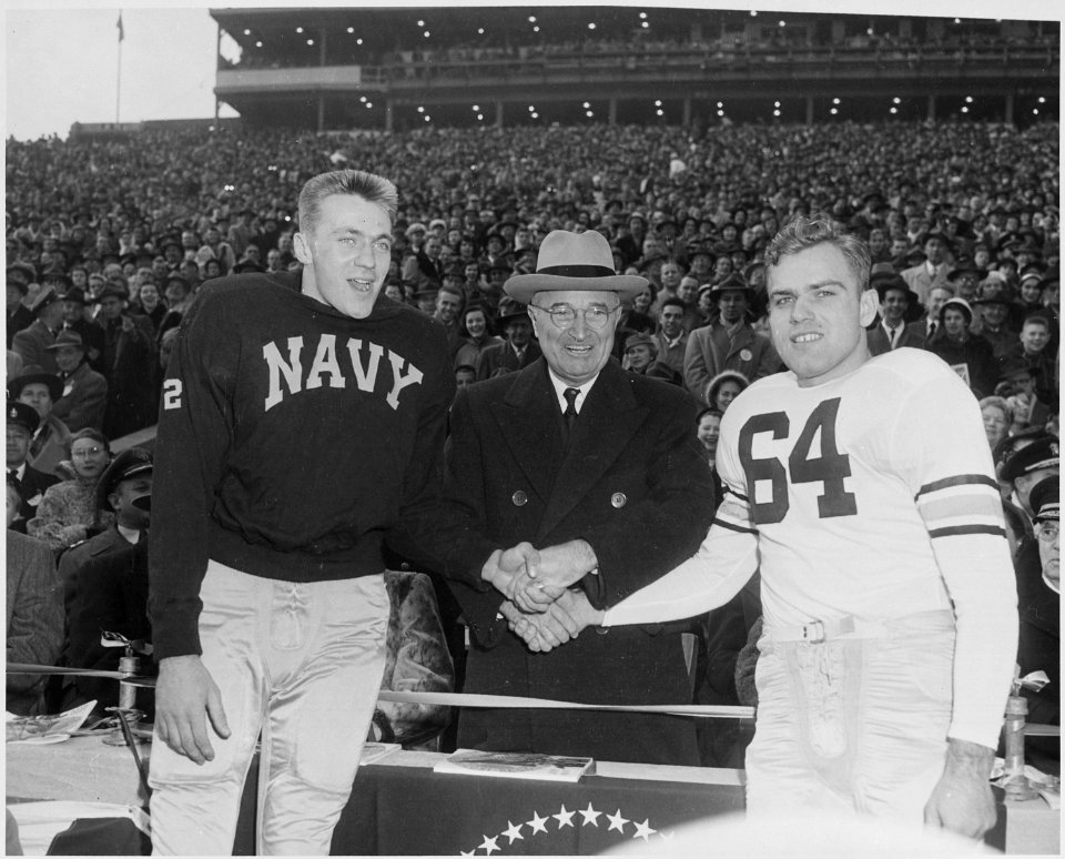 Photograph of President Truman shaking hands with the captains of the Army and Navy teams before their annual... - NARA - 200398