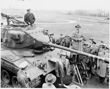 Photograph of President Truman standing next to the new T-41 Walker Bulldog tank, named after the late General... - NARA - 200277