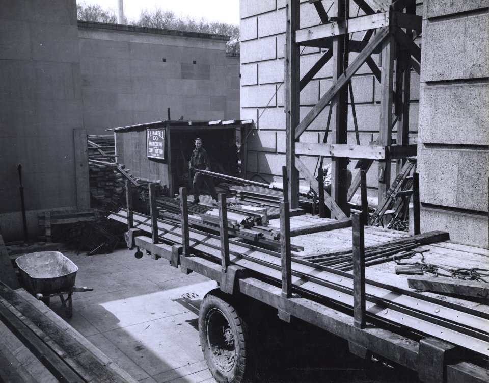 Photograph of Workers Unloading a Truck at the National Archives Building during Exterior Construction, Washington, D.C. (35226204104)