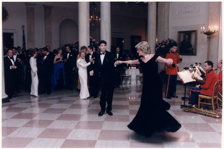 Photograph of Princess Diana dancing with John Travolta at a White House dinner for the Prince and Princess of Wales - NARA - 198569