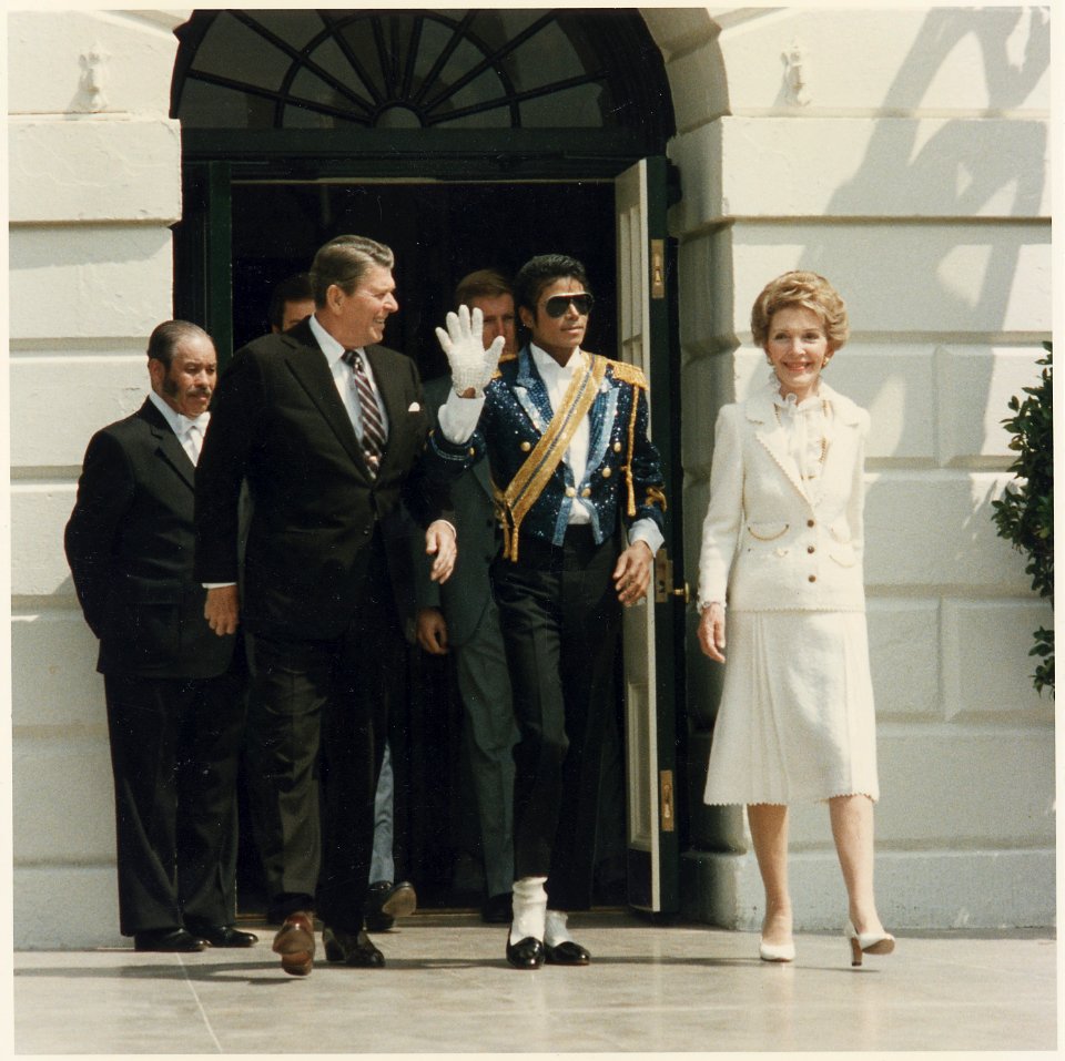 Photograph of The Reagans and Michael Jackson at the White House Ceremony to launch the Campaign against Drunk Driving - NARA - 198548