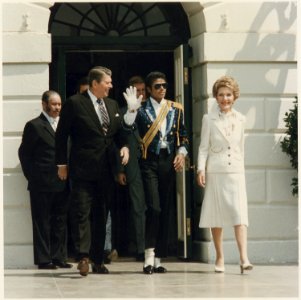 Photograph of The Reagans and Michael Jackson at the White House Ceremony to launch the Campaign against Drunk Driving - NARA - 198548