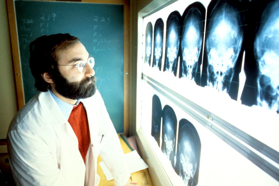 Physcian reviewing x-ray