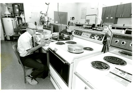 Physicist Laurence Andrews of the Energy Utilization Section monitors a variety of ranges to test their energy efficiency1 photo