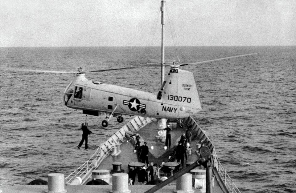Piasecki HUP-2 Retriever hovers over USS Boston (CAG-1), circa in 1959