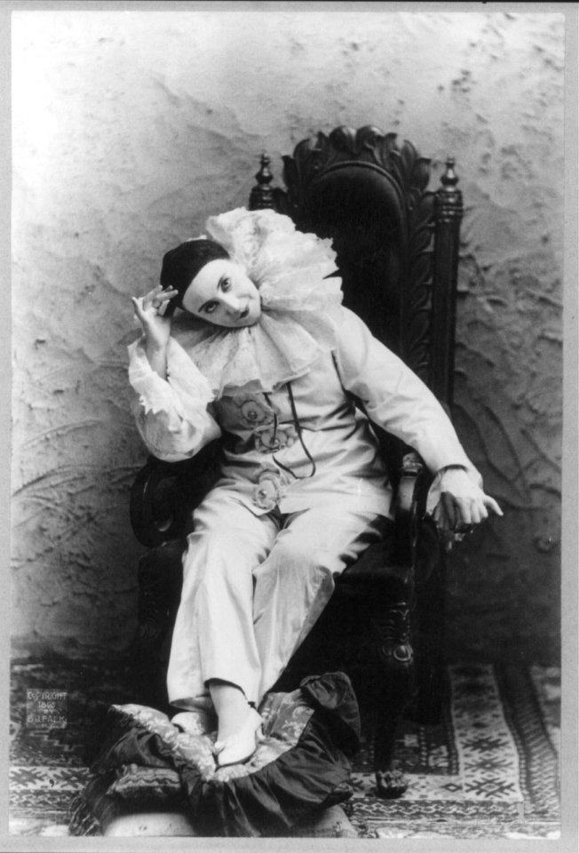 Pilar Morin as clown-mime- full length, seated, facing slightly left LCCN2003662117