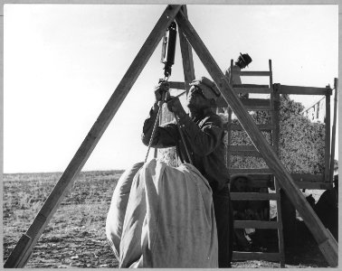 Pinal County, Arizona. Migratory cotton picker weighing in his morning's work at the cotton wagon. - NARA - 522010