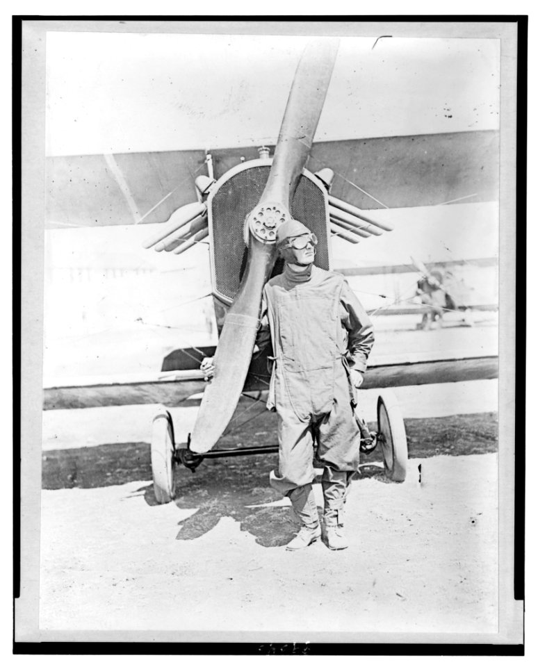 Pilot standing in front of U.S. Army airplane during World War I LCCN90706901