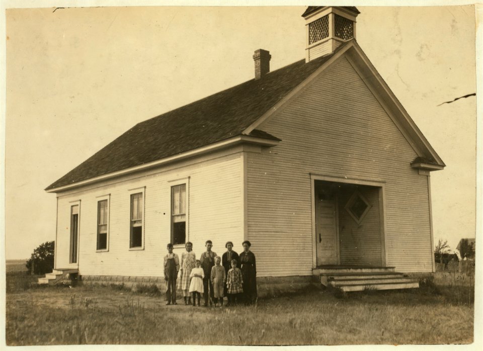 Pioneer School -13 (6 miles northwest of Shawnee) opened October 2nd-7 months term. Miss Lela Ginsinger, Principal (been here 2 years). Photo shows only 6 children present and 2 teachers in LOC nclc.00635
