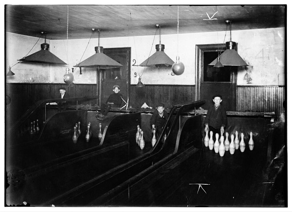 Pin-boys in a Pittsburgh Bowling Alley. They work until late at night. LOC nclc.05460
