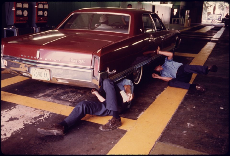 Public Works Department Employees Inspect the Exhaust System for Visible Leaks at an Auto Emission Inspection Station in Norwood, Ohio...08-1975 (4266526952)