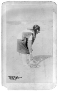 Pueblo girl rolling the mah-khur LCCN2004665526