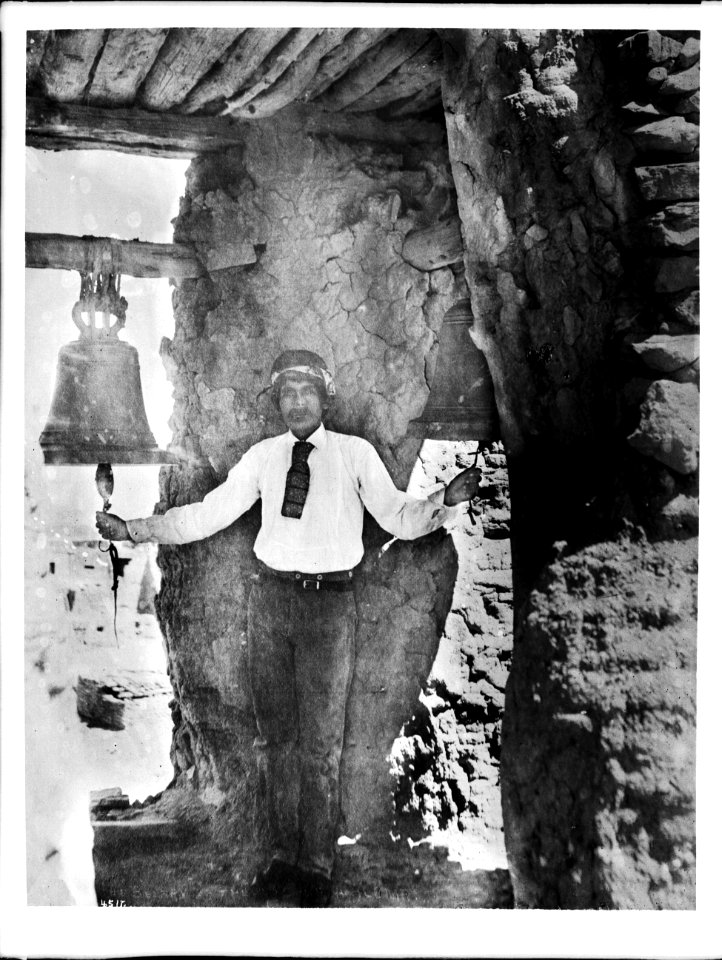 Pueblo Indian bell-ringer in the belfry of the old church, Acoma Pueblo, ca.1900 (CHS-4517)