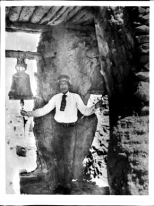 Pueblo Indian bell-ringer in the belfry of the old church, Acoma Pueblo, ca.1900 (CHS-4517)