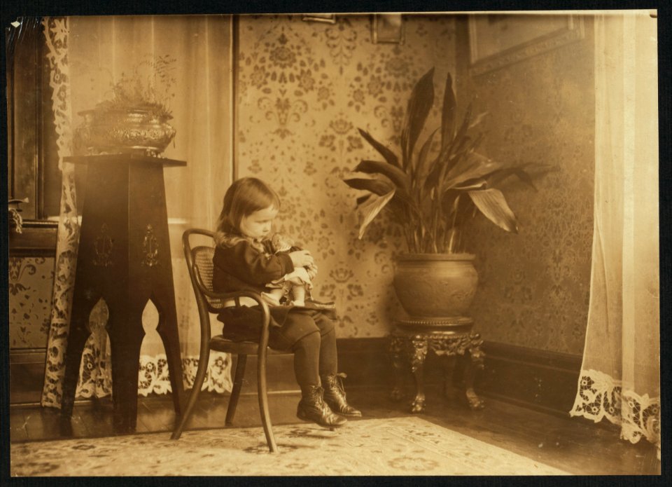 Putting a Campbell Kid to sleep. See photos showing where they are made. LOC nclc.04212
