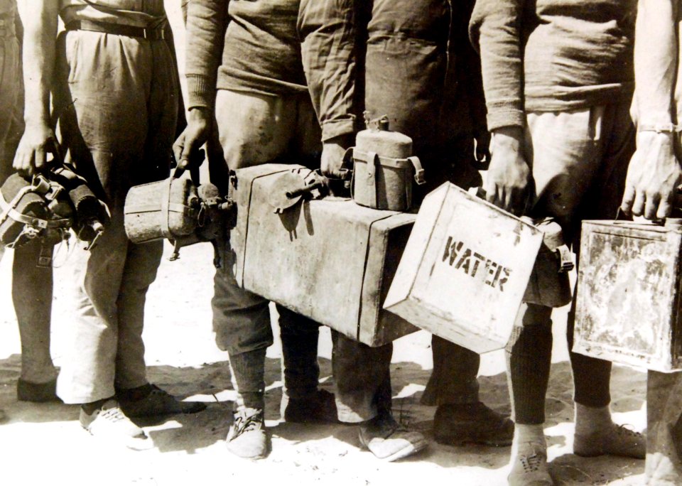Queuing up with carriers to get water, North African Campaign, WWII (36406679594)