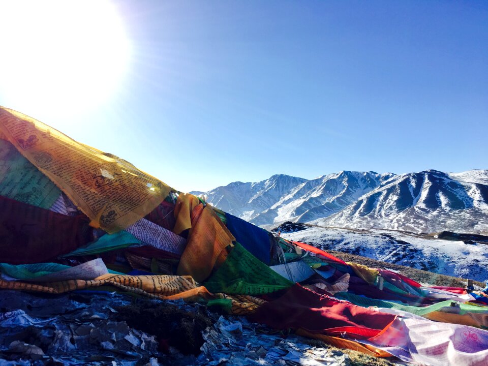 Backlighting tibetan snow mountain
