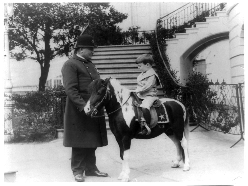 Quentin Roosevelt on pony beside White House policeman LCCN93508732
