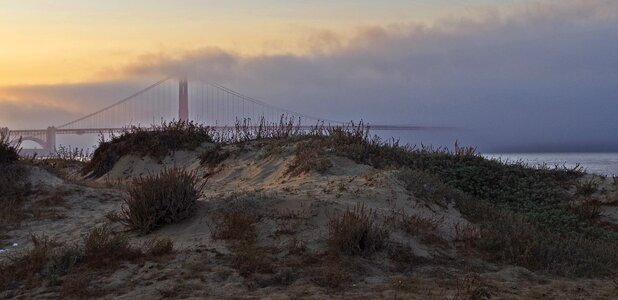 Sun landscape rising fog photo