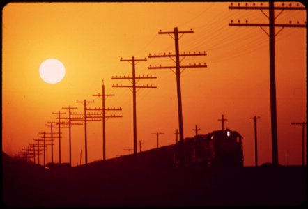 Railroad-and-transmission-lines-near-salton-sea-hazy-sun-is-caused-by-distant-los-angeles-smog-may-1972 7152604933 o