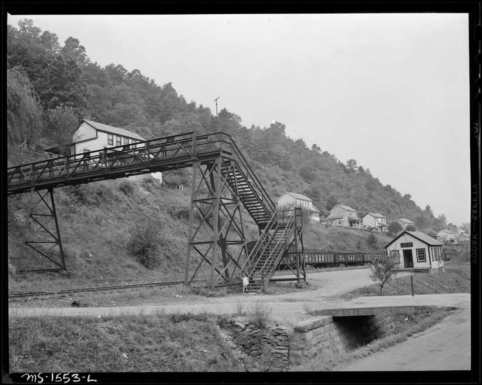 Railroad overpass. This is one of the very few overpasses seen in any coal camp where generally the hazard of... - NARA - 540852