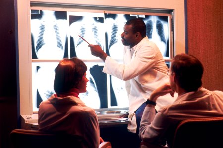 Radiologist examines chest x-rays photo