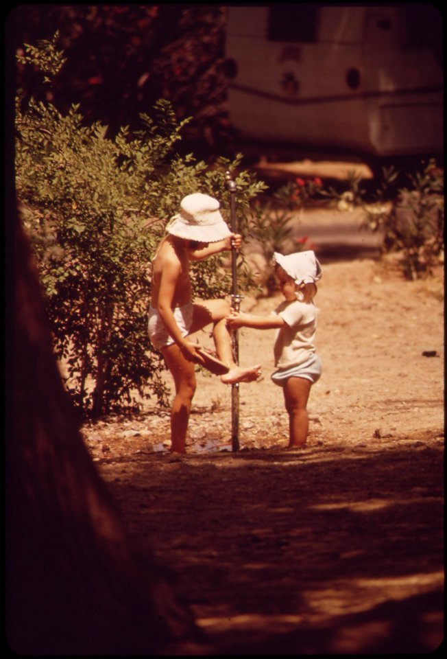 Raising-an-oil-blackened-foot-from-the-polluted-water-of-lake-mead-may-1972 6990479520 o