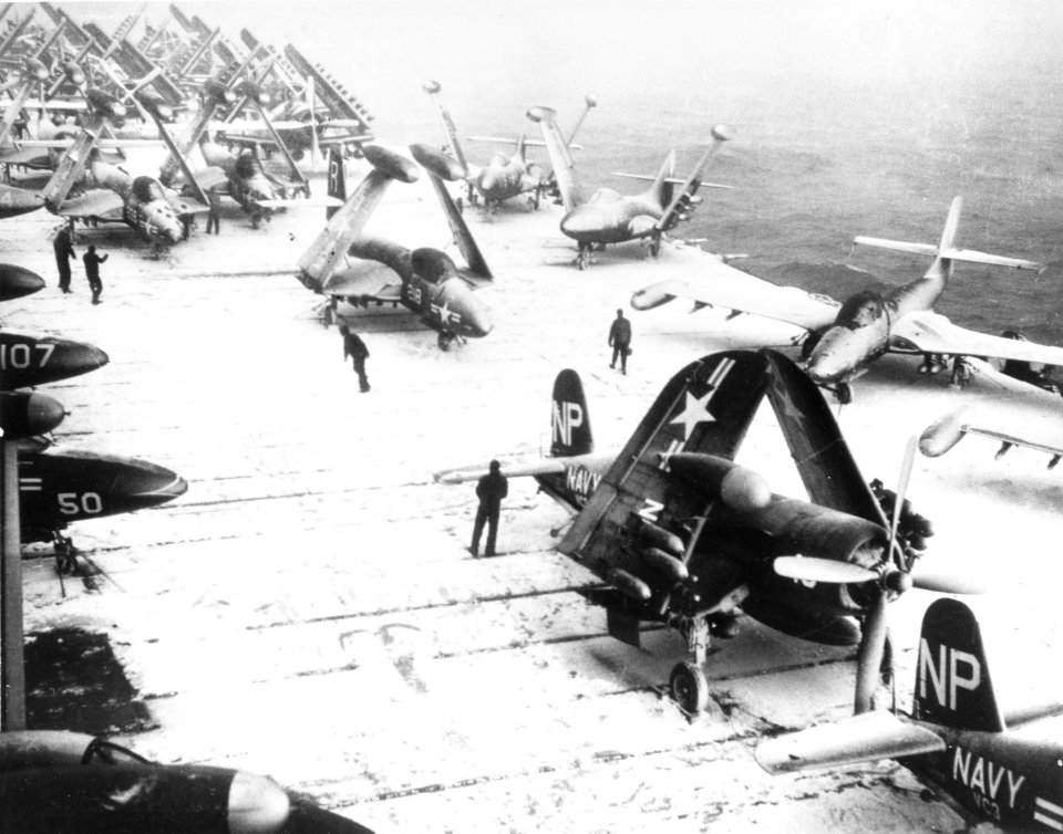 Planes on snowy flight deck of USS Essex (CV-9) off Korea in January 1952