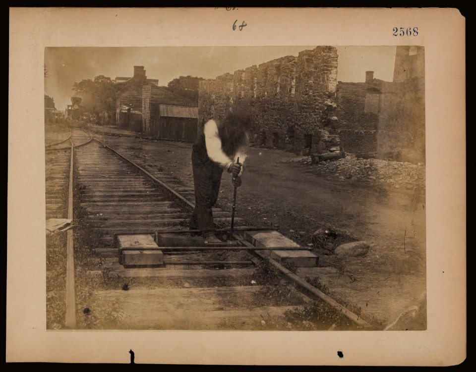 Railroad construction worker straightening track LCCN2006676187