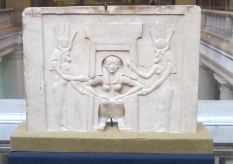 Plaque of a woman giving birth assisted by Hathor