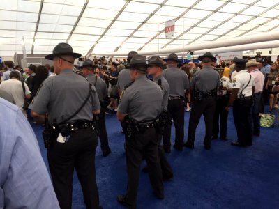 Police watch Sanders protesters in the press tent CoU WiFVMAACwxh