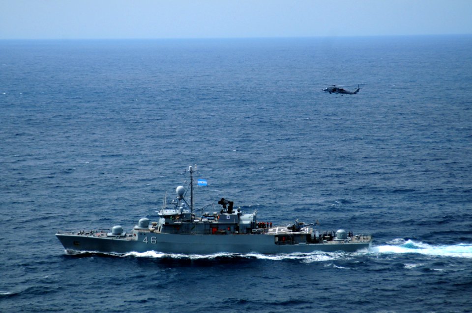 Port side view of ARA Gomez Roca (P 46) underway during Southern Seas 2010 with HS-15 HH-60H Sea Hawk overhead 100308-N-0808V-071