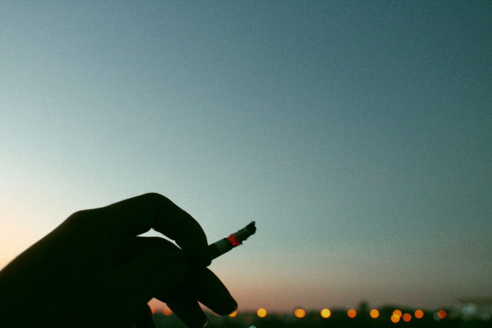 Dark hand cigarette