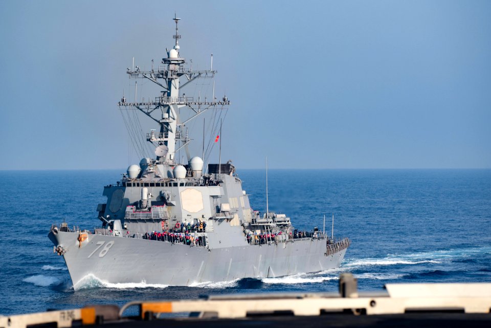 Port bow view of USS Porter (DDG-78) pulling alongside USS Harry S. Truman (CVN-75) during underway replenishment 180510-N-NQ487-0466