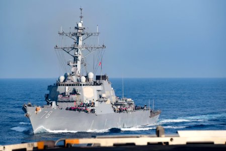 Port bow view of USS Porter (DDG-78) pulling alongside USS Harry S. Truman (CVN-75) during underway replenishment 180510-N-NQ487-0466
