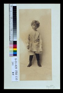 Portrait of a young boy standing in short pants and belted shirt) - the Misses Selby, N.Y LCCN2004676273