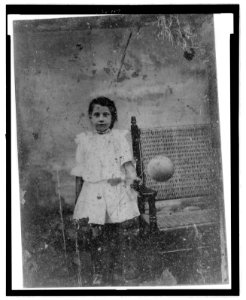 Portrait of a young girl holding a balloon LCCN2006689598