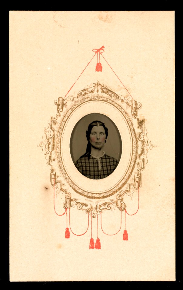 Portrait of a woman in a checkered dress, her image framed by gold and red decorative motif LCCN2016653258