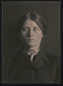 Portrait of an unidentified woman, facing front, wearing dark clothing and scarf LCCN2017659331