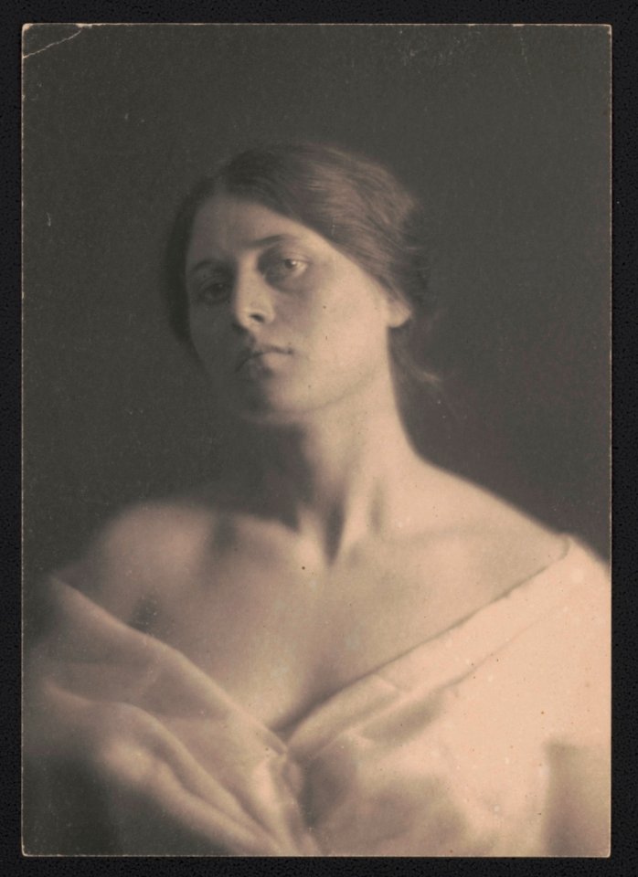 Portrait of an unidentified woman, facing front, wearing off-the-shoulder v-neck attire LCCN2017659329