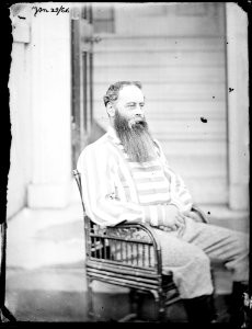 Portrait of Lord Alan Spencer-Churchill seated and wearing a striped shirt (31531558393)