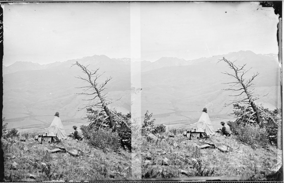 Possibly S.R. Gifford sketching, beside dark tent. On the Blue, looking west across the river. Summit County, Colorado. - NARA - 517615